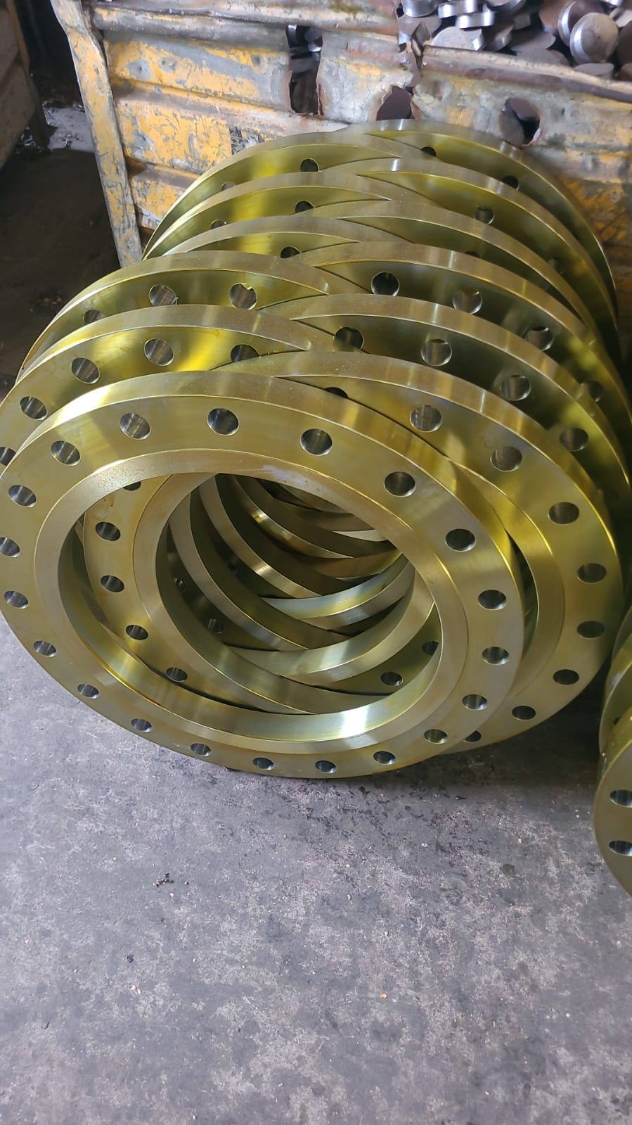 Finished machined flanges arranged at the workshop
