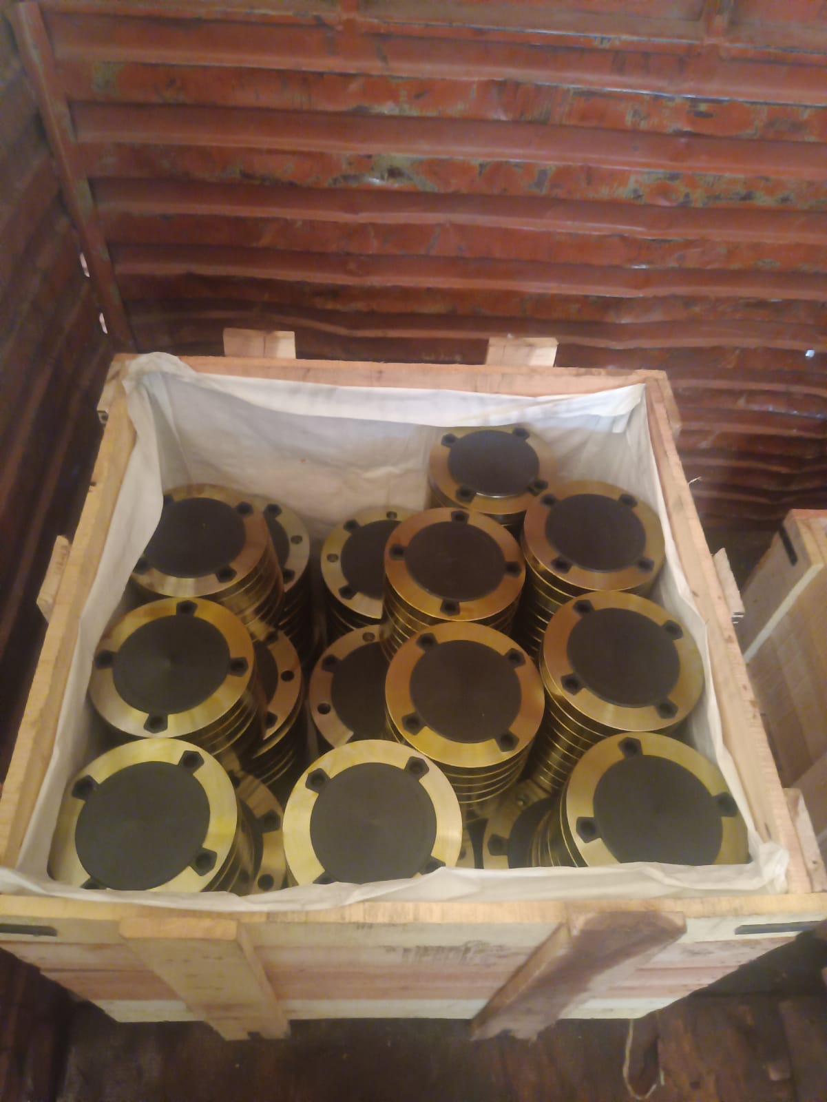 Stacks of blind flanges with protective covers packed for dispatch