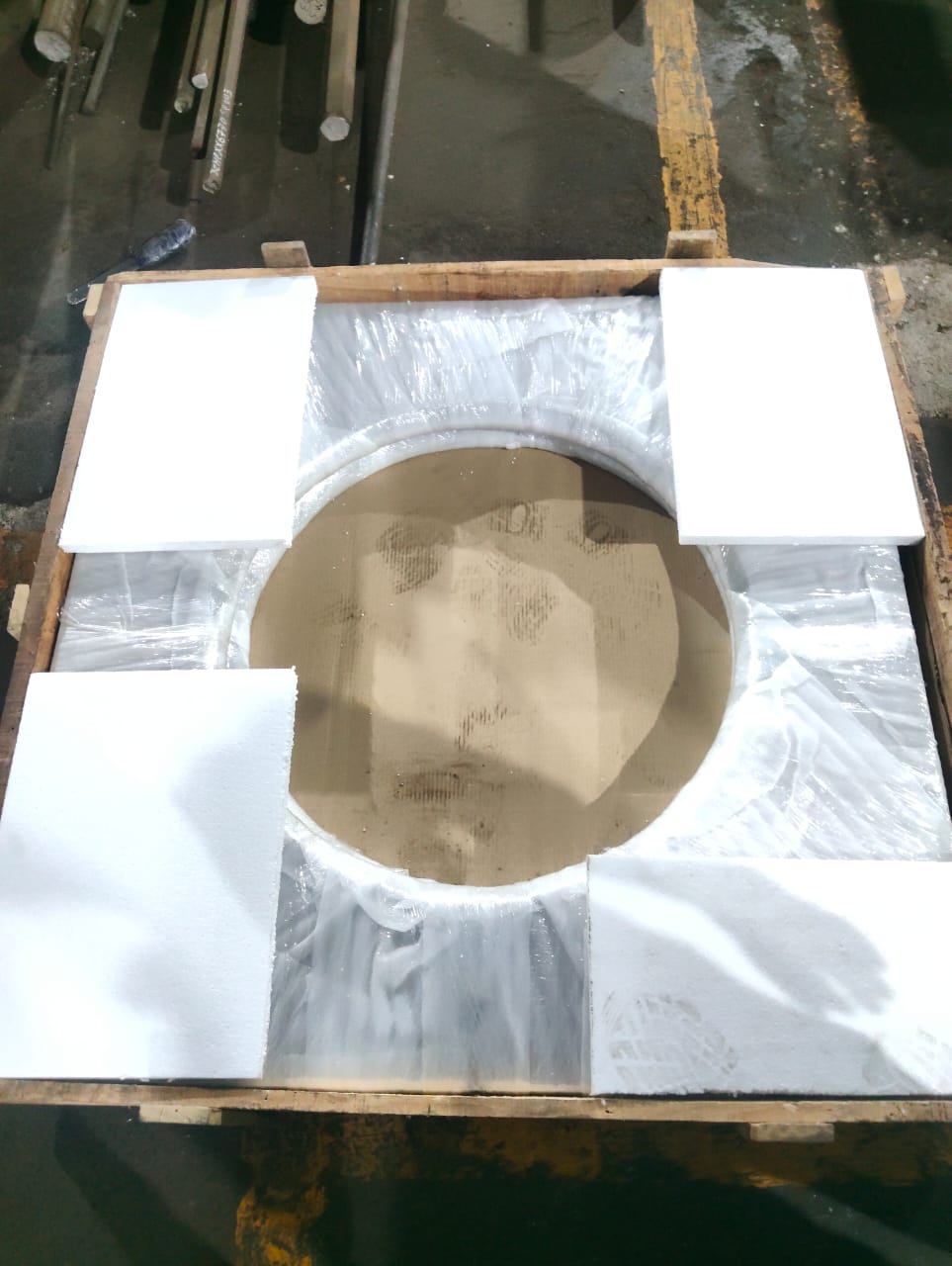 Large circular machined component protected for transport