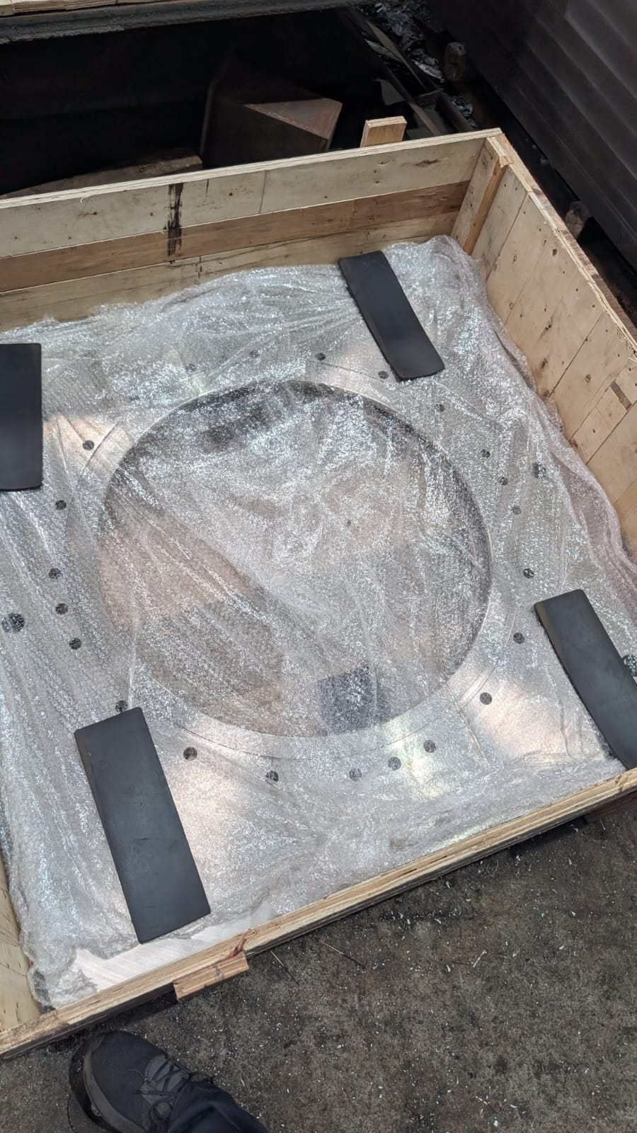 Large custom flange wrapped and secured inside a timber crate