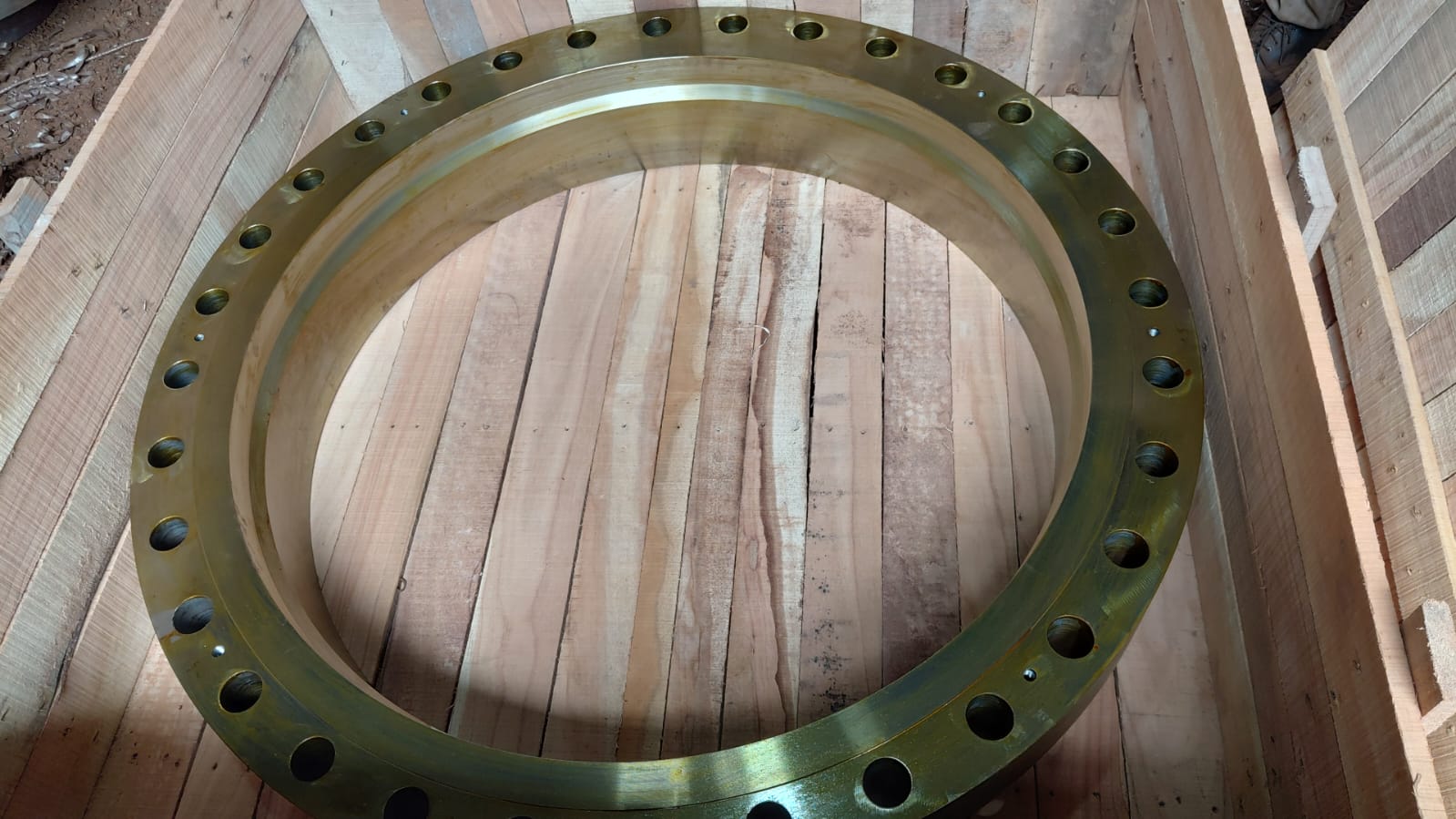 Large custom machined flange resting inside a timber crate