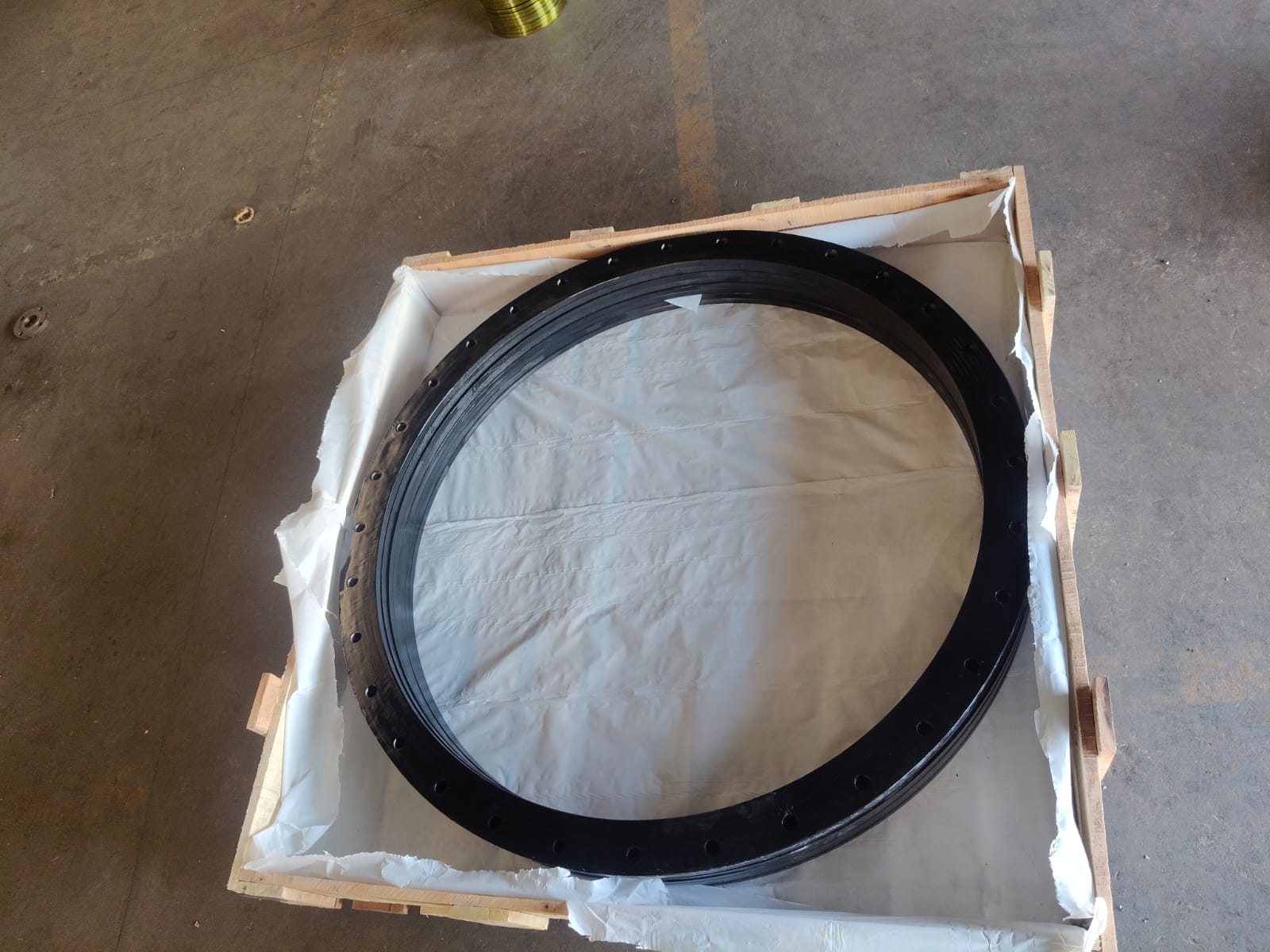 Large coated ring component prepared in a timber base