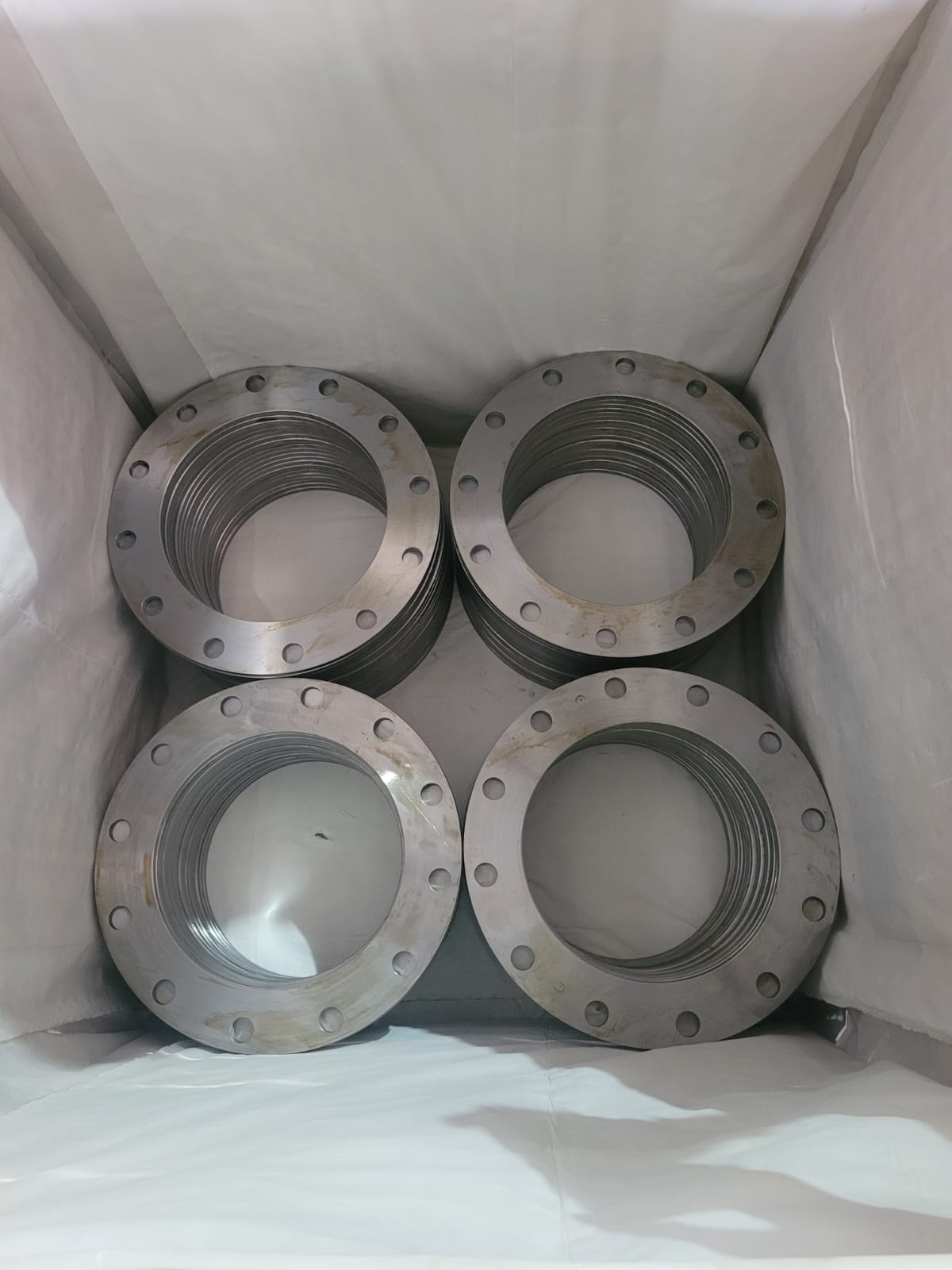 Four groups of machined flanges arranged inside protective packing