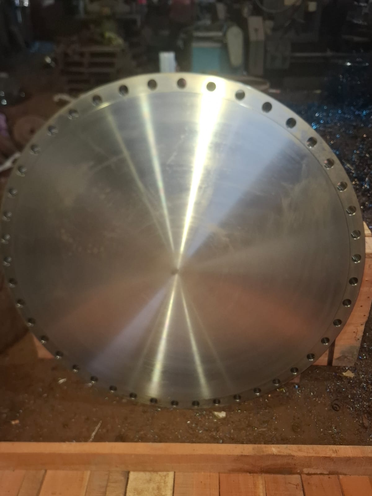 Large precision-machined blind flange with drilled bolt holes
