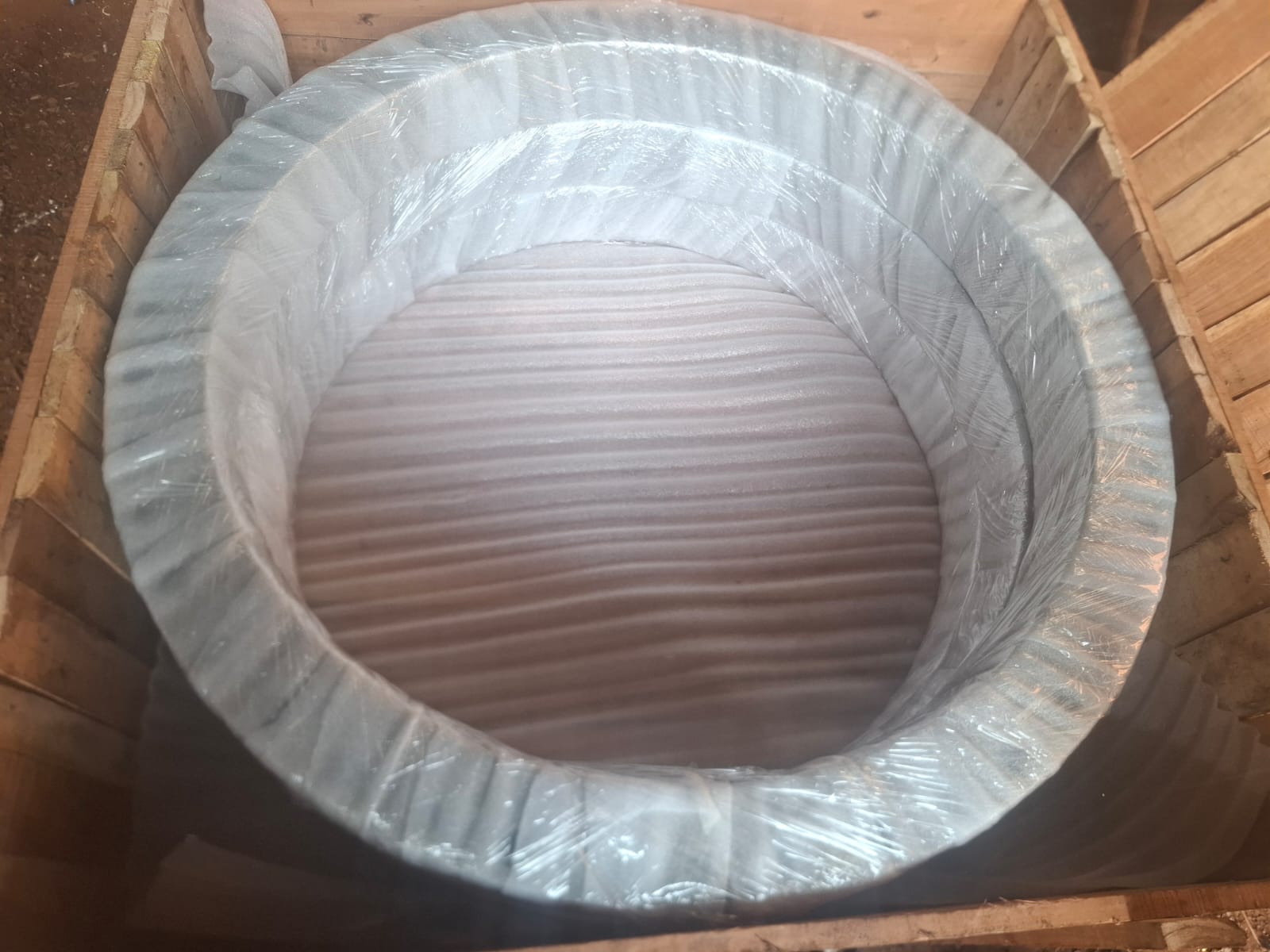 Heavy ring component wrapped and protected inside a timber crate